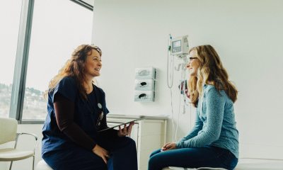 Patient sits on exam table and talks to provider